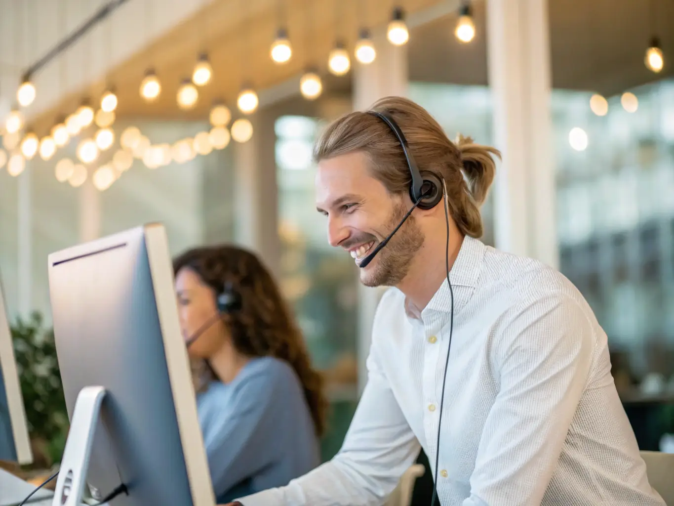 A dedicated support team member assisting a client remotely via video call, showcasing proactive support and personalized service.